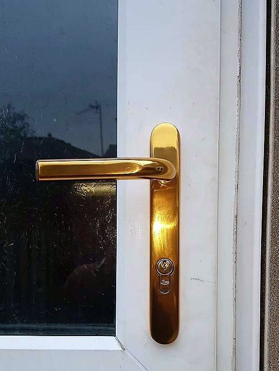 A new gold uPVC door handle fitted by Jon