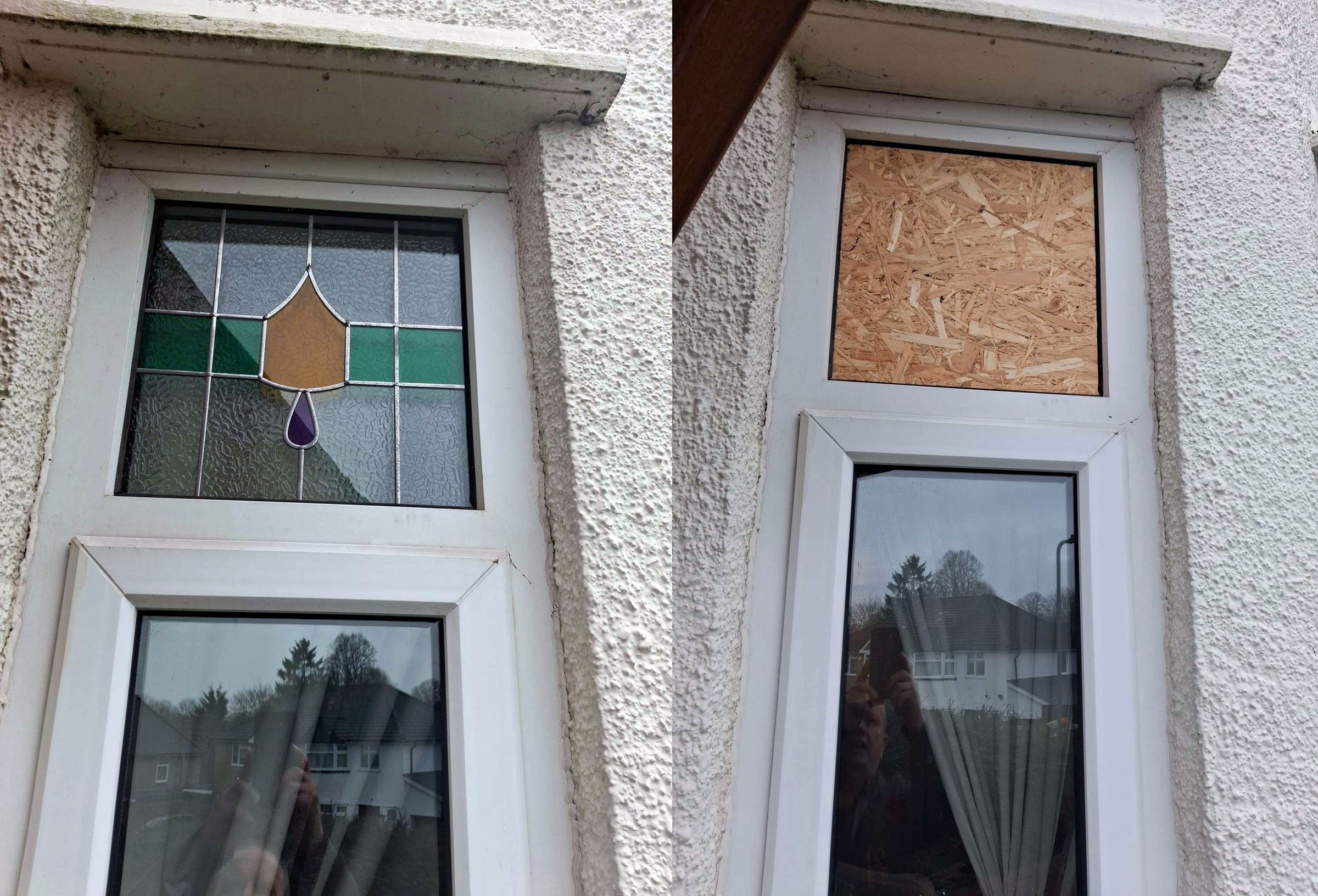 A broken window pane boarded up next to a leaded window